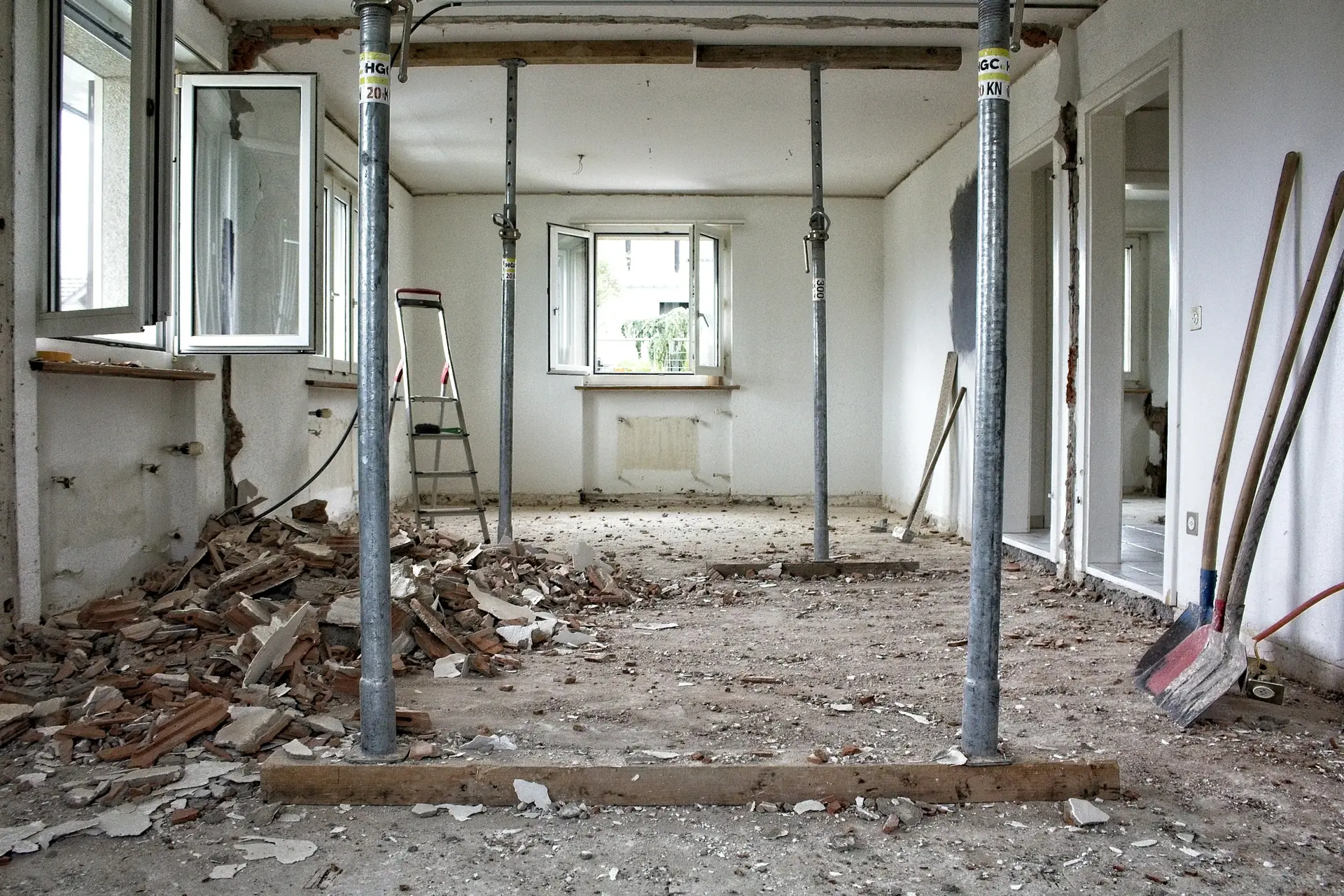 A room mid-renovation with debris on the floor